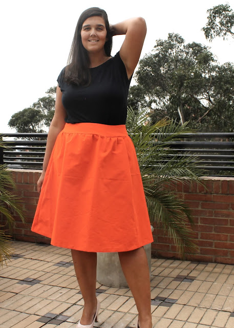 Orange faille skirt sewn from the Simplicity 1369 sewing pattern.
