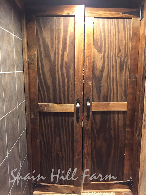 beautiful barnwood bathroom with reclaimed barn door
