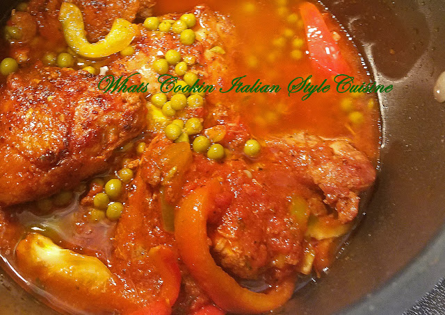 This is a saucepot with chicken thighs and peas similar to a stew made on top of the stove with fresh tomato sauce