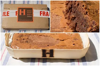 A wooden tray with an H on for Hobbs House Bakery containing a chocolate brownie