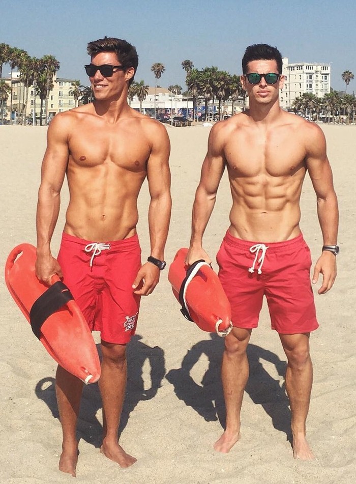 two-handsome-shirtless-male-lifeguards