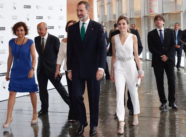 Queen Letizia wore Massimo Dutti White Jumpsuit and Magrit Sandals, carried Magrit clutch bag, coolook earrings