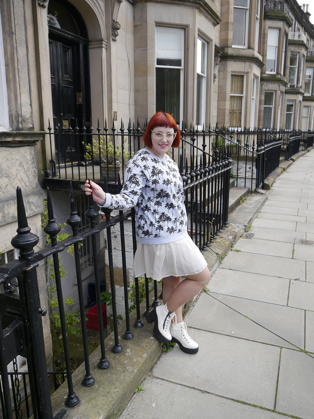 Dressing for Fun in a Boxy Jumper Scottish blogger, Edinburgh blogger, Scottish street style, quirky street style, dressing to a theme, food inspired outfit, pale girl style, Spex Pistols glasses, red head, red hair, H&M, patterned jumper, palm tree sweatshirt, white pleated dress, white boots, lace up shoes, milk necklace, Tiny Treat Boutique necklace, milk bottle jewellery, Lucky Dip Club