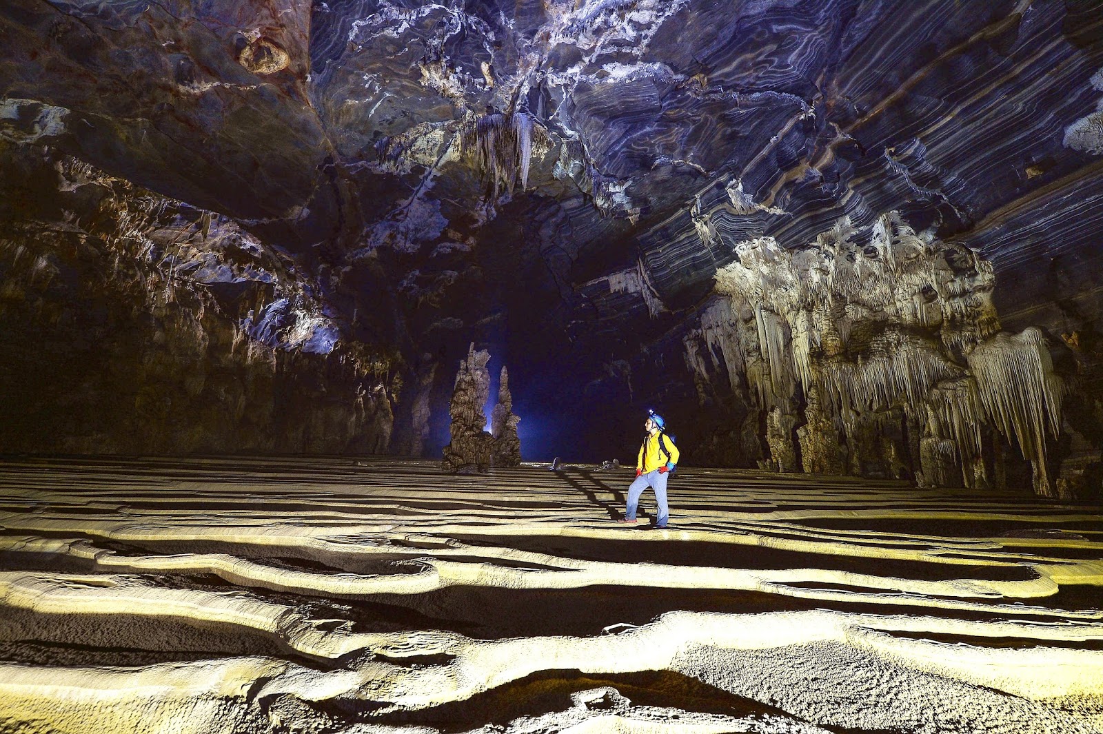 Descending into the pitch black caves of Tu Lan