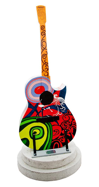Orillia painted guitar display, multicolour abstract design with red and black