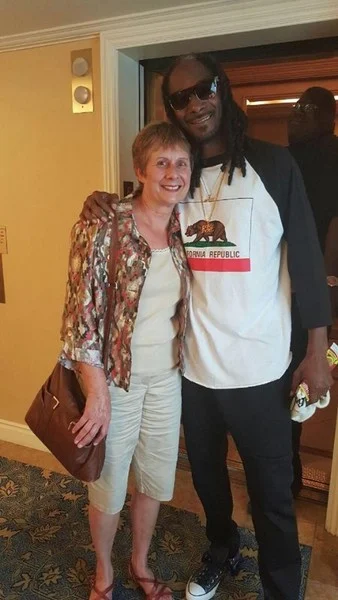 Snoop Dogg and Ginny Prior by the elevator at The Fairmont San Jose in California