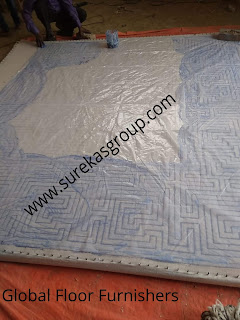 image trace being put on canvas cloth for weaving of hand-tufted rug image trace being put on canvas cloth for weaving of hand-tufted rug