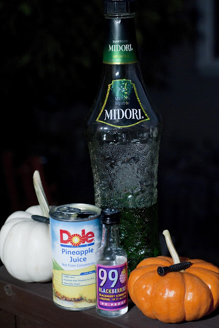 Halloween cocktail shot, Frankenstein, pineapple juice, melon liqueur, Midori, blackberry schnapps