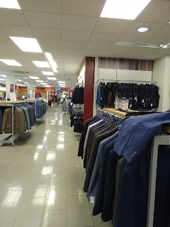 clean and bright shop floor with suits 