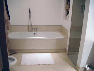 Walk in shower, floor curved vanity, curved skirting, Balzac limestone bathroom