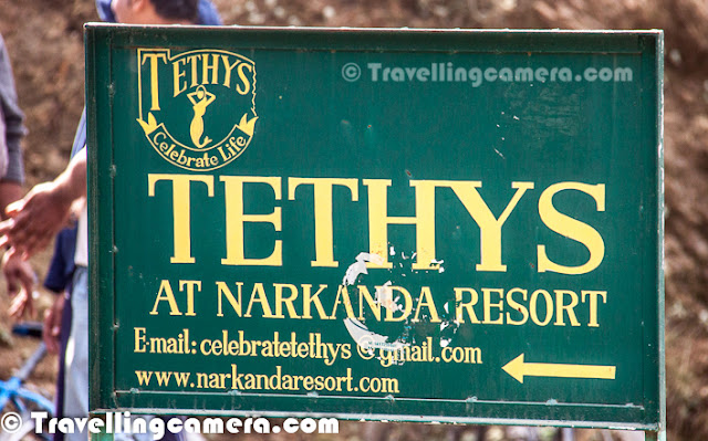 It was the time, when we were on 10 days expedition in upper ranges of Himachal Pradesh. We were going through villages without touching main highways and on the way we come across this wonderful place to have some snacks and move ahead. After a long time, we though of sharing some of the Photographs we shot at Tethy's Resort.These photographs are approximately one year old, when some renovation work was under progress. This Resort has a huge building with decent facilities and few huts on the right. We couldn't check huts, so no comments about those. But they looked interesting from outside...We were at Tethy's for some tea and snacks... Some of the journalists were accompanying us who were quite familiar with the place... While the snacks were being prepared, we had a round of the resort and had a look at some of the rooms/facilities at Tethy's Resort... Above photograph shows the reception area with wonderful seating arrangements and a snooker table...Somehow, it's amazing to see very creative/artistic taste of Furniture in many of the Hilly Reosrts/Hotels. I can understand that, hilly states are rich in terms of timber n all but still some creative minds are always required to make best use of it. Interiors of reception were really catchy as compare to all other places in the campus.This view wowed us, when we looked outside from one of the room-windows at Tethy's Reosrt. All rooms facing valleys have wonderful view. Resort has huge glass-windows which face this beautiful valley and in the bottom of the valley, some Apple Orchards can be seen. Most of the hills around this place has apple orchards. Although this resort in in middle of a forest but quite near to main highway and well connected.Resort has some huge rooms/suites... It seems the place is quite popular among bikers and bollywood folks. There is a high peak near this resort which is wonderful place for bollywood folks to shoot and adventurous route for Bikers/Hikers. It's Hatu Peak, that attracts many folks to this part of hilly ranges.At  around 10k feets among the dense woodlands of mixed tropical forests, this place has wonderful aerial view.  Tethy's is surrounded by the villages, apple orchards and dense forest cover.... and the place Narkanda is endowed with pristine beauty. Fresh air rejuvenates you and calm surroundings tranquilizes the soul of every visitor to this regionHere is one of the windows with wonderful view to the valley from one of the suites at Tethy's ResortAccording to the mythological and Geological concept Himalayas emerged from the vast ocean called Tethys and is youngest of all mountains. It seems resort is named on that fact only.Tethys Retreat Narkanda, a decent retreat on the western end commands a splendid view of the Hatu peaks in the front with the interlocking spurs decked with rich forest cover.