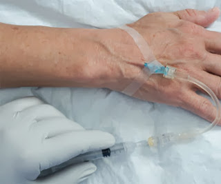 line flush heparin lock saline inserted again after converting primary