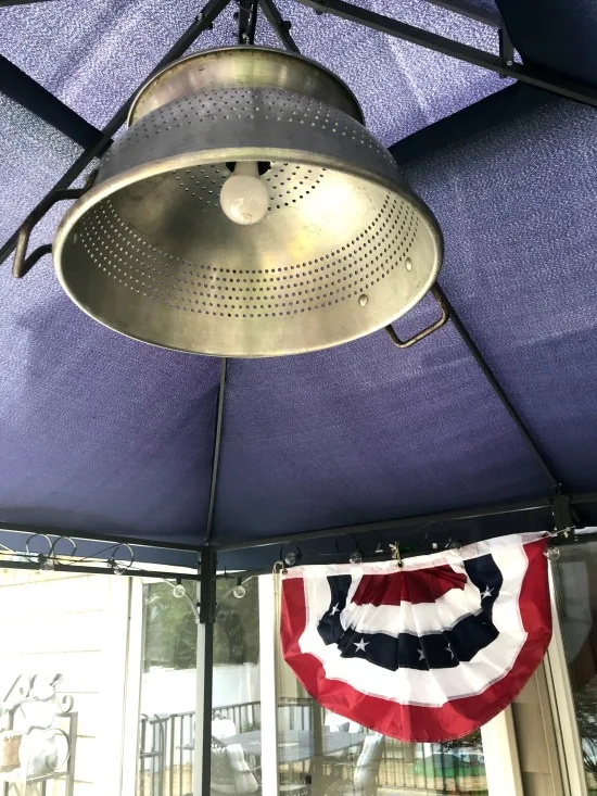 Colander hanging from gazebo