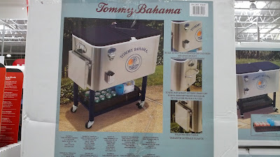 Tommy Bahama Roller Cooler with side table, storage space, and bottle opener