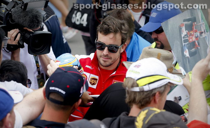 Fernando Alonso signs autographs for fans, while wearing Oakley Garage Rock Sunglasses