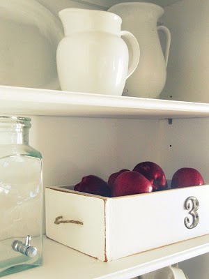 This simple white drawer adorned with a number is great for storing fresh apples.