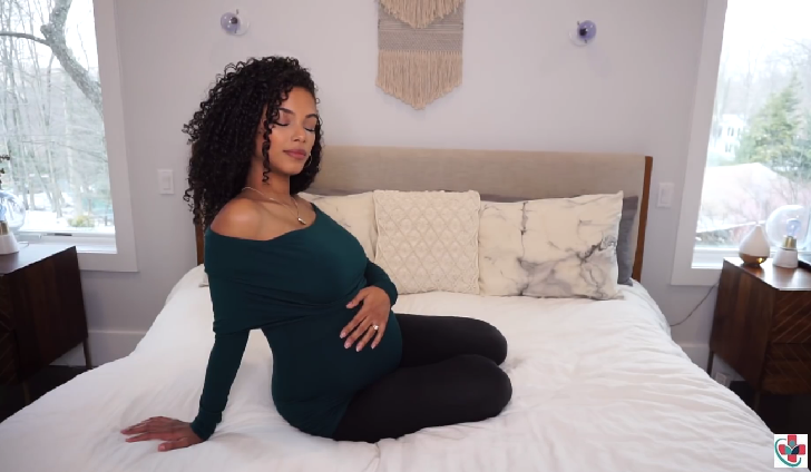 Pregnant woman on the bed