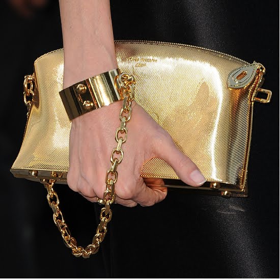 Angelina Jolie Handcuffs Purse To Wrist In Toronto Fashion Fling Because You Can Actually Handcuff It To Your Wrist Angelina Paired Hers With A Sleek Vivienne Westwood Gown Which Was Simplistic And Sophisticated
