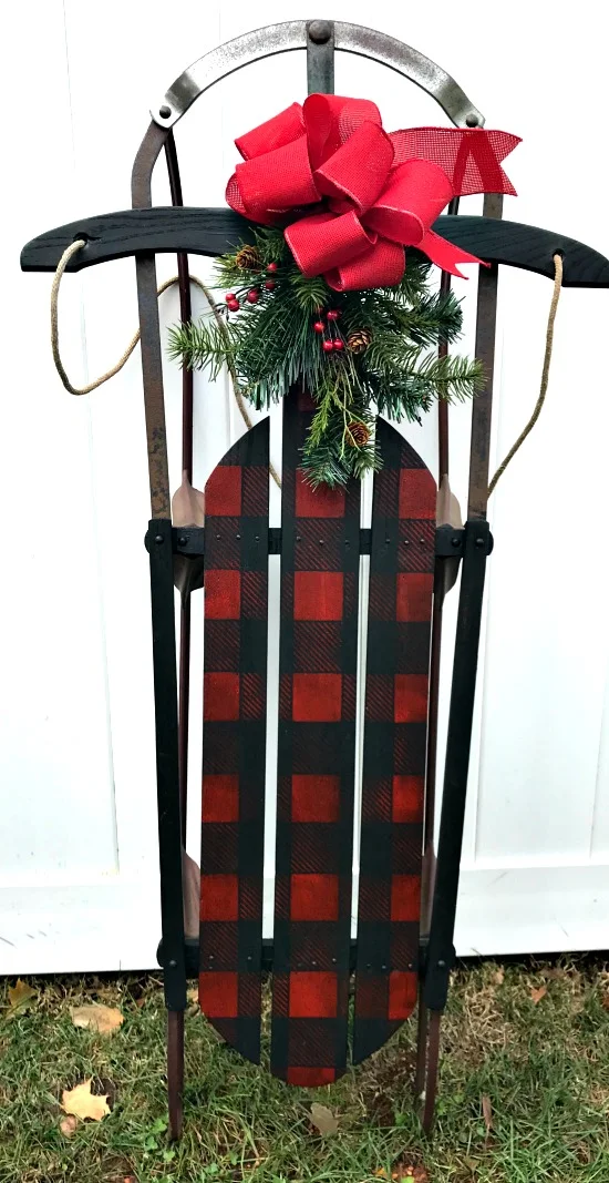 Red plaid stenciled sled