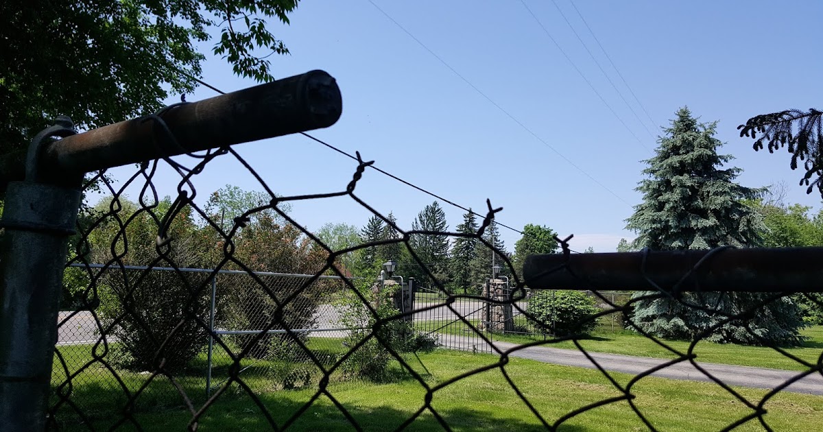 Gear Acres at Top of the Hill Fixing a Broken Top Rail on a Chain Link Fence