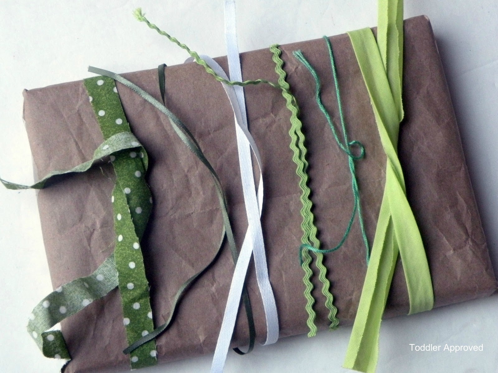 Toddler Approved! A Brown Paper Package Tied Up With Strings