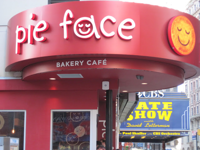Catch a glimpse of the Ed Sullivan theater right around the corner from the New in New York Pie Face