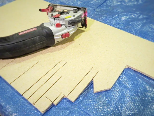 cutting out the design with a compact saw