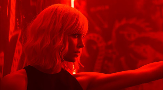 Charlize Theron as Lorraine Broughton in ATOMIC BLONDE. atomic blonde red movie still