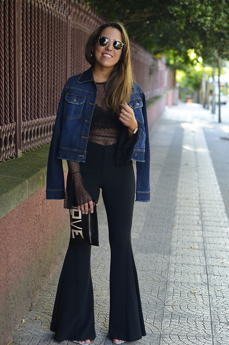 Streetstyle - Wearing flare pants, denim jacket, sheer top, ray ban round sunglasses and Love clutch
