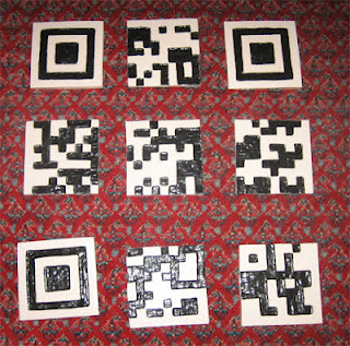 These individual ceramic tiles become a QR code when assembled in the correct sequence.