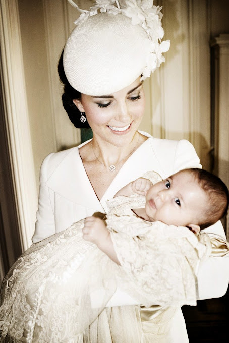 Catherine, Duchess of Cambridge and her daughter Princess Charlotte of Cambridge pose for a photo in the Drawing Room at Sandringham House after the christening of Princess Charlotte of Cambridge on the Sandringham Estate 