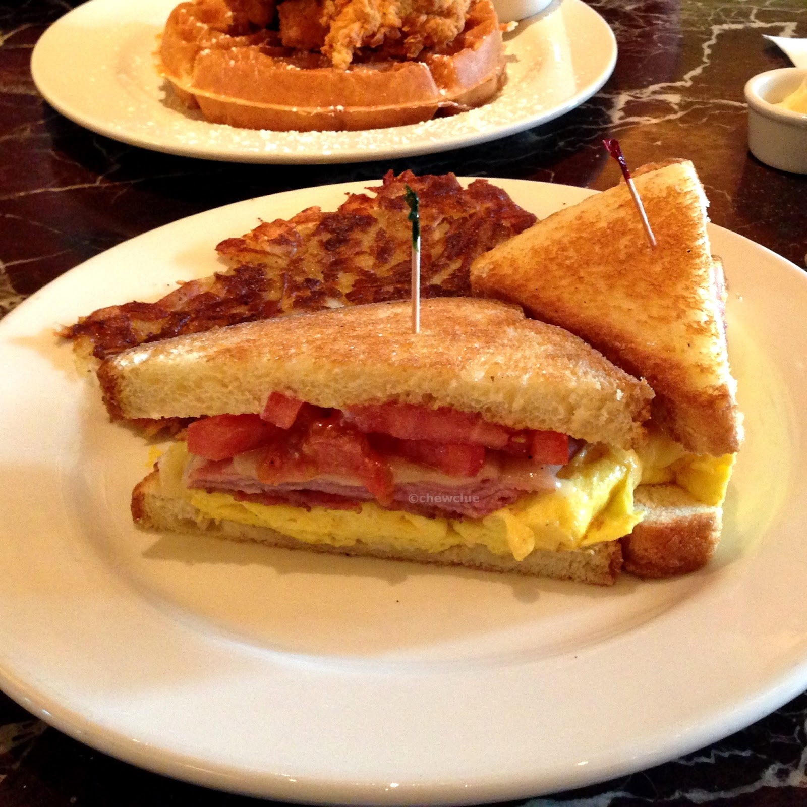 bichromatic Destination Grand Lux Cafe DeLux Peach Bellini, DeLux Breakfast Sandwich & Fried