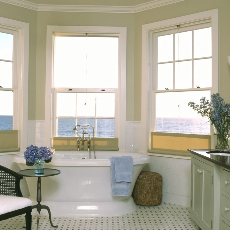 Charming traditional coastal decor in bathroom of Malibu beach house by Giannetti Home