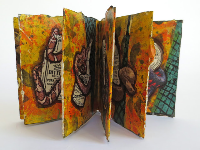 Handmade collaged accordion book about snakes