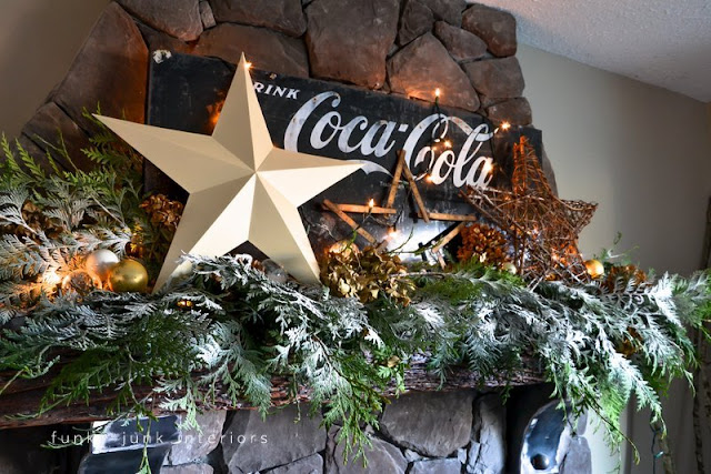 Coca Cola inspired Christmas fireplace mantel decorating with stars - via : https://www.funkyjunkinteriors.net/ Coca Cola inspired Christmas fireplace mantel decorating with stars - via : https://www.funkyjunkinteriors.net/