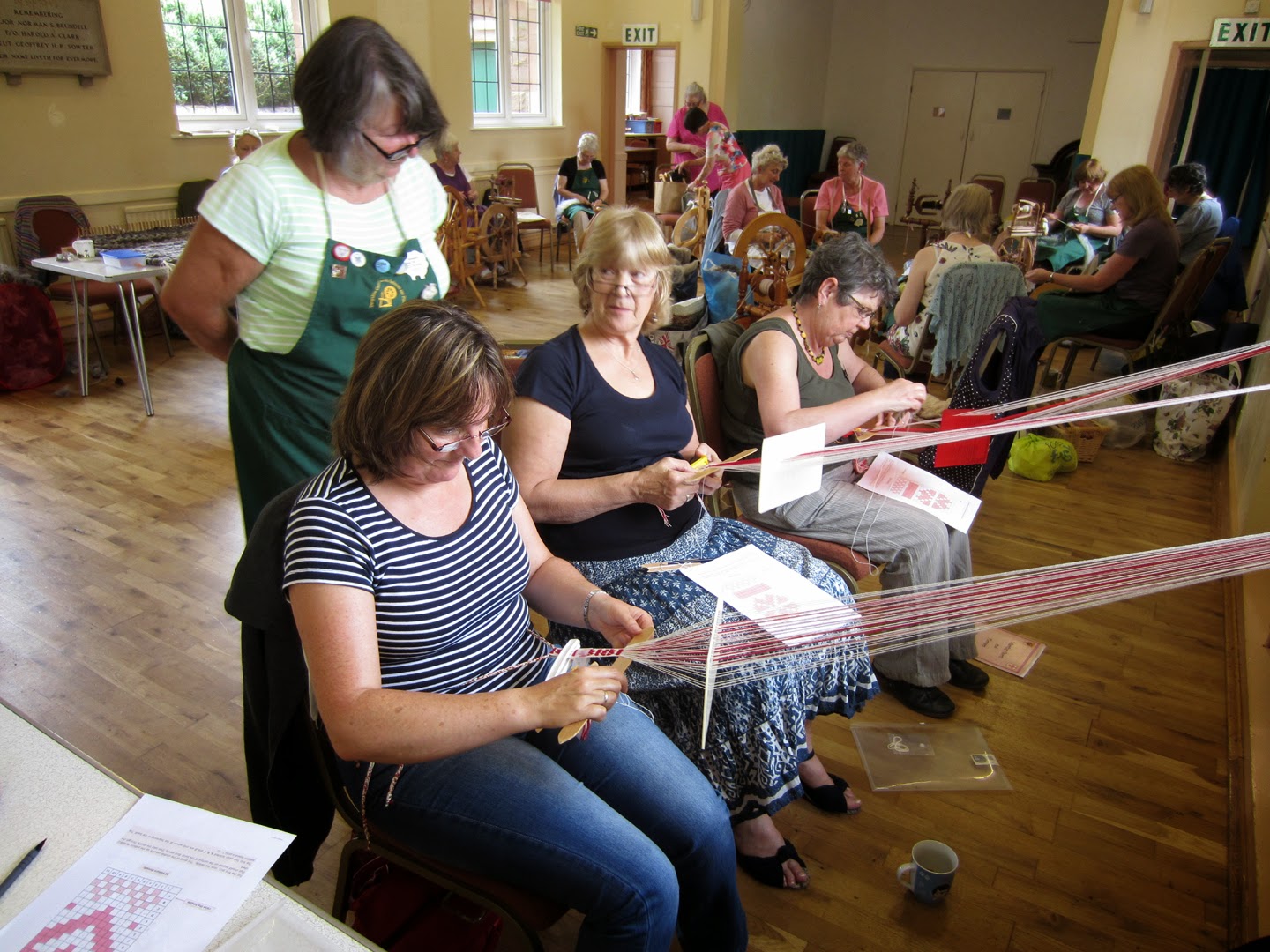 Durham Weaver weaving with a double slotted heddle.