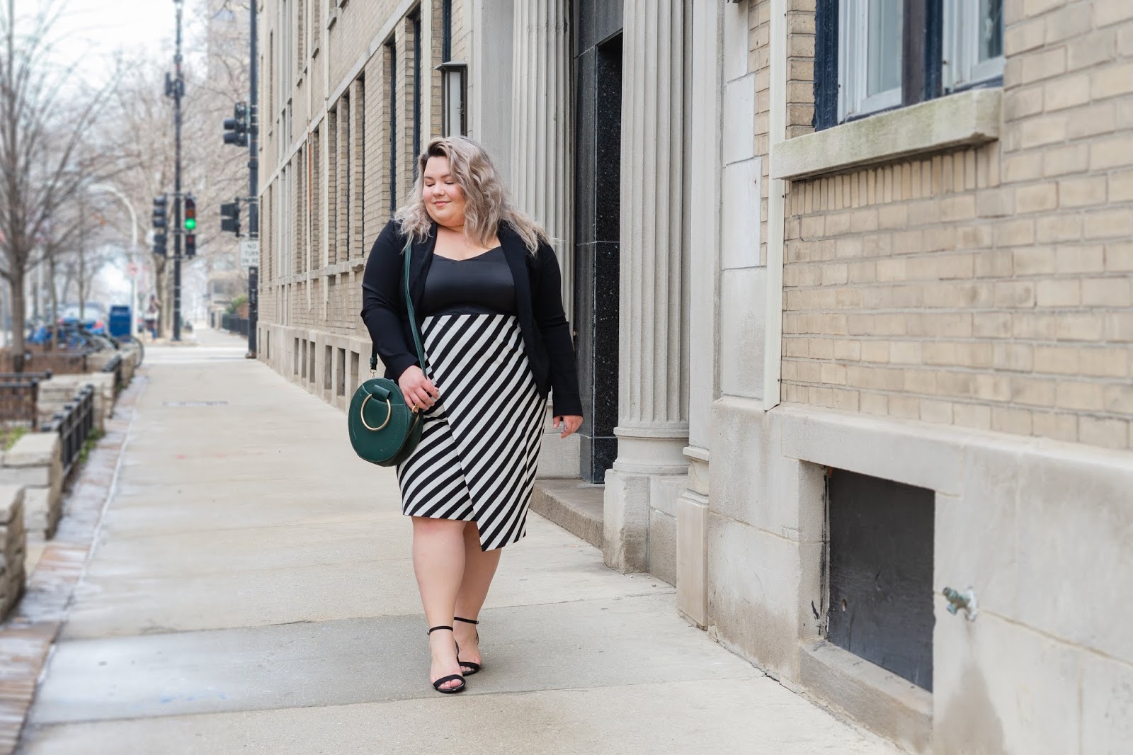 Chicago Plus Size Petite Fashion Blogger, YouTuber, and model Natalie Craig, of Natalie in the City, reviews Maree Pour Tai's plus size workwear.