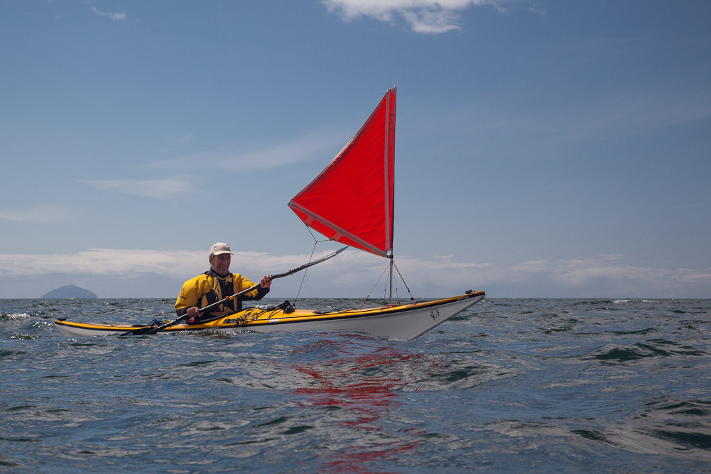 Sea kayaking with The power of kayak sailing.
