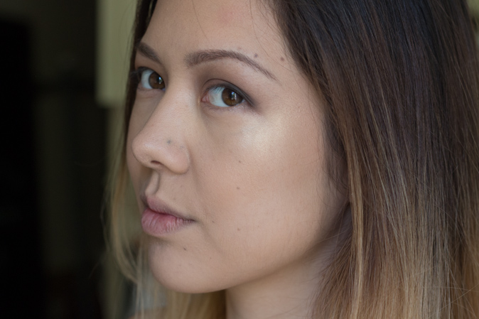 becca x jaclyn hill shimmering skin perfector highlighter champagne pop worn on face