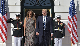 President Trump and Melania lead an emotional moment of silence on the White House lawn for the victims of Las Vegas massacre joined by Ivanka and staff after denouncing it as an 'act of pure evil'