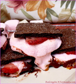 Chocolate, caramel and strawberry flavors marry to form a special treat: Supreme S’mores. Grill, microwave or bake for a year round quick dessert. | Recipe developed by www.BakingInATornado.com | #recipe #dessert #chocolate