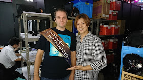 IGN Japan's Esra Krabbe (wearing his "Shenmue Respect Champion" sash) backstage with Matsukaze-san.