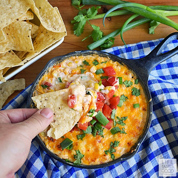 Hot Corn Dip Recipe | by Life Tastes Good is an easy-to-make appetizer that is ready to eat in just 10 minutes! Loaded with sweet crunchy corn, tangy cream cheese, and spicy tomatoes, this Mexican inspired dip won't last long at your next party!