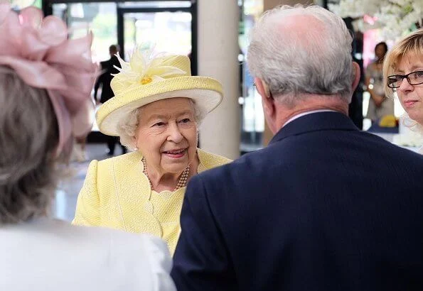 The traditional 'Ceremony of the Keys' took place tonight at Holyroodhouse in Edinburgh. yellow dress, jcoat and hat