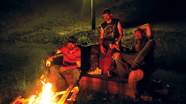 rednecks around a camp fire