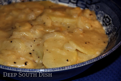 Sliced potatoes are tossed with onion in seasoned flour, then fried in a bit of hot oil, covered and smothered with milk for a slow simmer. Simple, delicious comfort food.