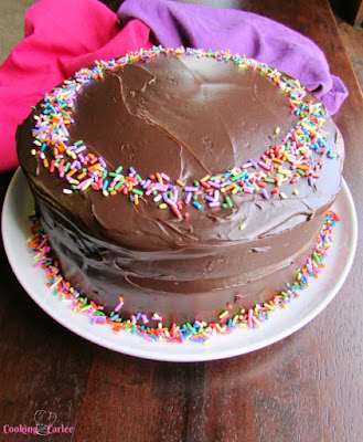 Chocolate cake that is devilishly good. This cake is rich, moist, delicious and super simple to put together. All you need is a bowl, a whisk and a little bit of time. devilishly good chocolate cake with shiny fudge frosting and sprinkles