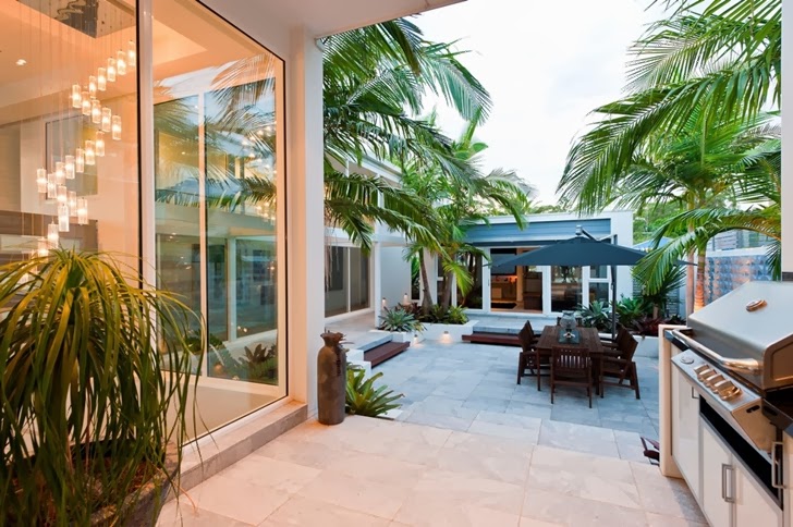 Glass windows and terrace in Coastal Oasis landscape project by Urban Exotic