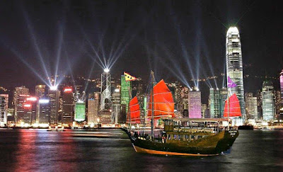 Traditional Chinese Junk Boat Crossing Victoria Harbour Hong Kong