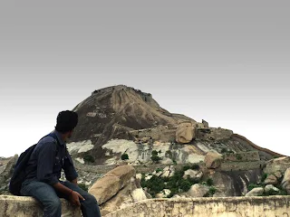 Hiker admires the sheer giganticness of the mighty Madhugiri